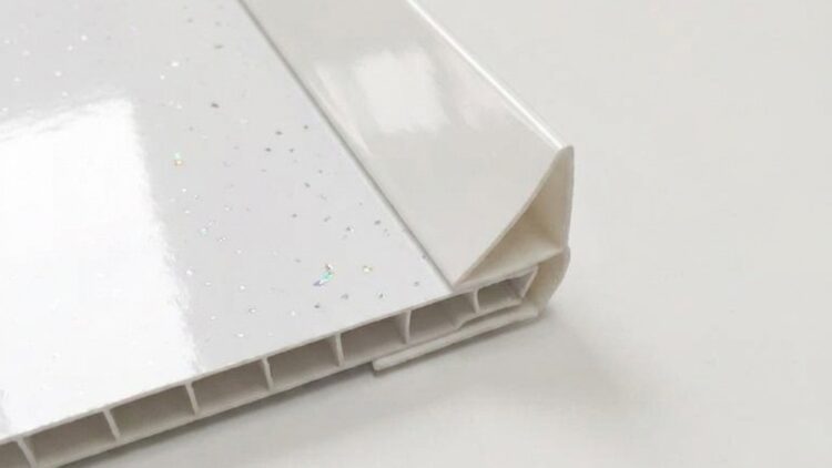 Ceiling coving trim White ceiling coving trim fitted neatly along a pvc cladded bathroom wall